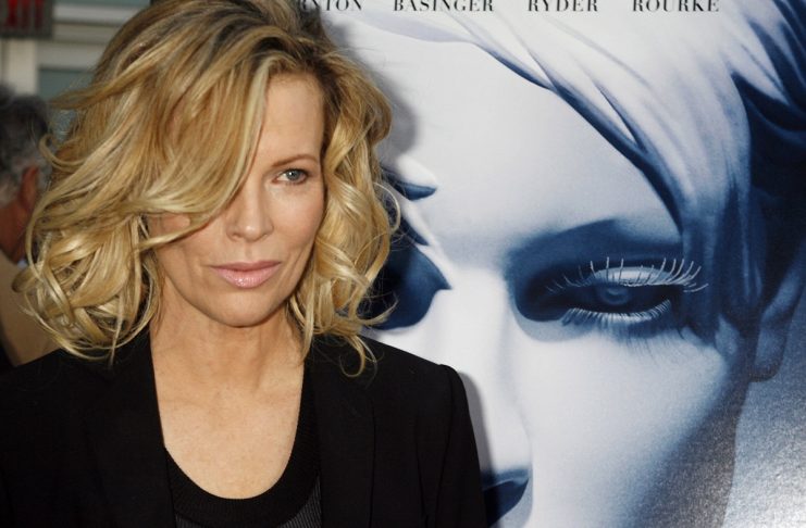 Actress Kim Basinger, star of the film “The Informers”, poses at the film’s premiere in Hollywood