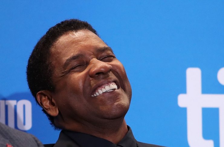 Actor Denzel Washington attends a press conference to promote the film The Magnificent  Seven at TIFF.