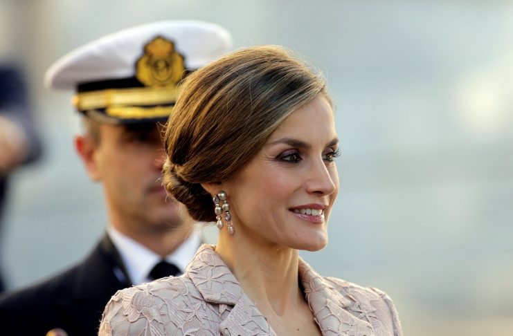 Spain’s Queen Letizia smiles during official welcoming ceremonies at the start of an official visit to Porto