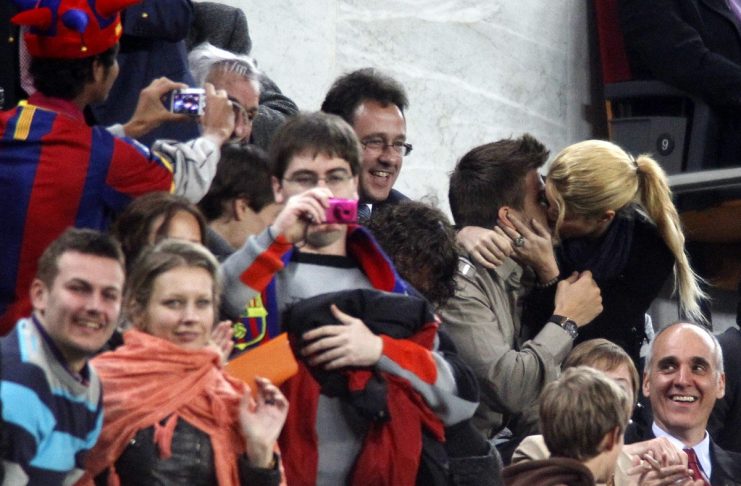 Barcelona’s player Gerard Pique kisses Colombian singer Shakira at Nou Camp stadium in Barcelona