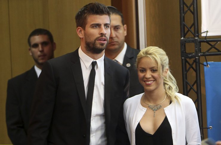 Colombian pop star and United Nations Children’s Fund ambassador, Shakira, walks with her boyfriend Gerard Pique, after her joint news conference with Israel’s president Peres at 3rd annual Israeli Presidential Conference in Jerusalem