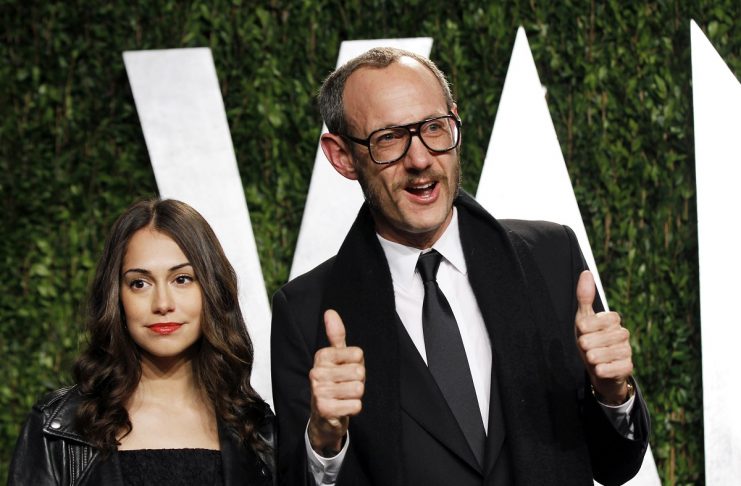 Fashion photographer Terry Richardson gestures next to an unidentified guest as they arrive at the 2012 Vanity Fair Oscar party in West Hollywood
