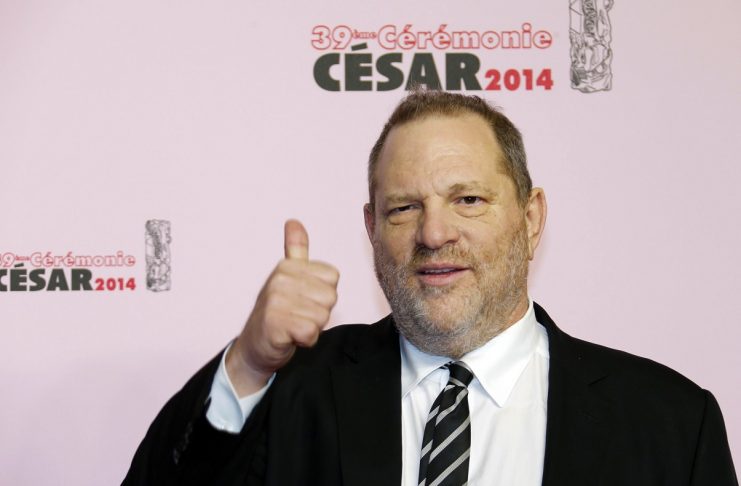 Producer Harvey Weinstein gestures as he arrives at the 39th Cesar Awards ceremony in Paris