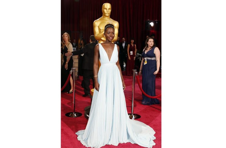 Lupita Nyong’o, best supporting actress nominee for her role in “12 Years a Slave” and wearing a Prada gown, arrives at the 86th Academy Awards in Hollywood
