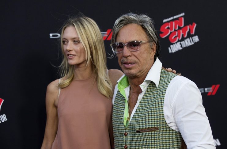 Cast member Rourke and Makarenko pose at the premiere of “Sin City: A Dame to Kill For” in Hollywood