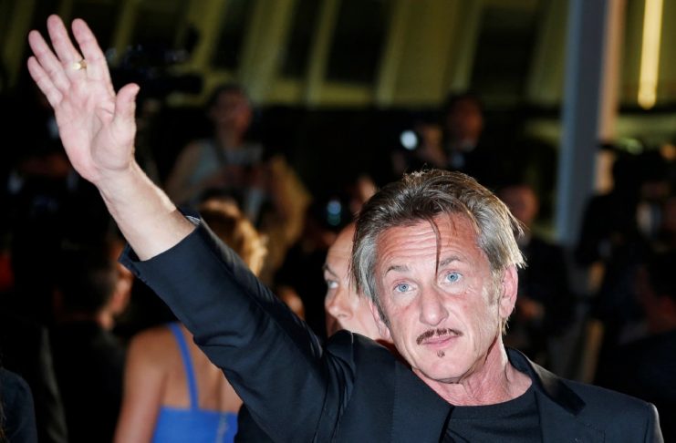 Director Sean Penn waves to cinema fans after the screening of the film “The Last Face” in competition at the 69th Cannes Film Festival in Cannes