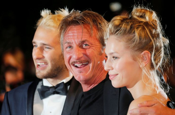 Actor and director Sean Penn poses with his children actor Hopper Jack Penn and actress Dylan Penn on red carpet as they leave after the screening of the film “The last Face” in competition at the 69th Cannes Film Festival in Cannes