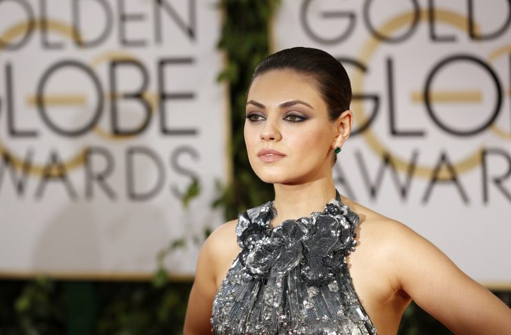 Actress Mila Kunis arrives at the 71st annual Golden Globe Awards in Beverly Hills