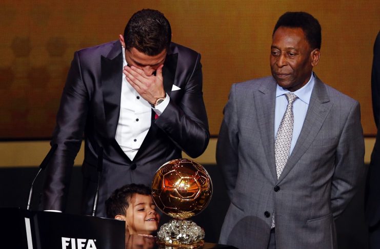 Portugal’s Cristiano Ronaldo reacts beside his son Cristiano Ronaldo Jr and Pele after being awarded the FIFA Ballon d’Or 2013 in Zurich