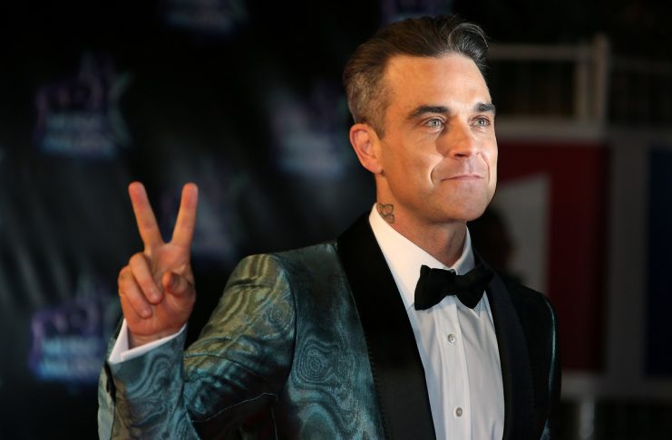 Singer Robbie Williams arrives to attend the NRJ Music Awards ceremony at the Festival Palace in Cannes