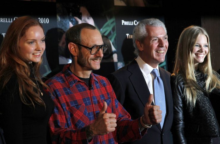 Model Cole, photographer Richardson, Pirelli President Provera and model Horst pose for photographers during a presentation of the 2010 Pirelli calendar in London