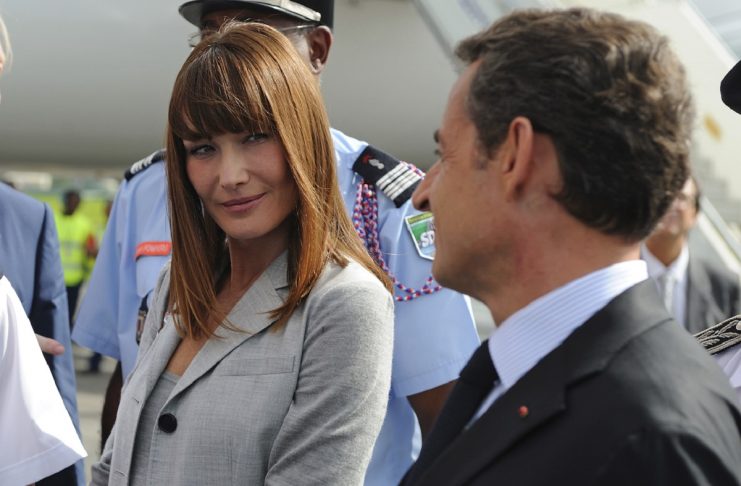 France’s President Sarkozy and his wife Carla Bruni-Sarkozy arrive at Pointe-a-Pitre airport on the Guadeloupe island