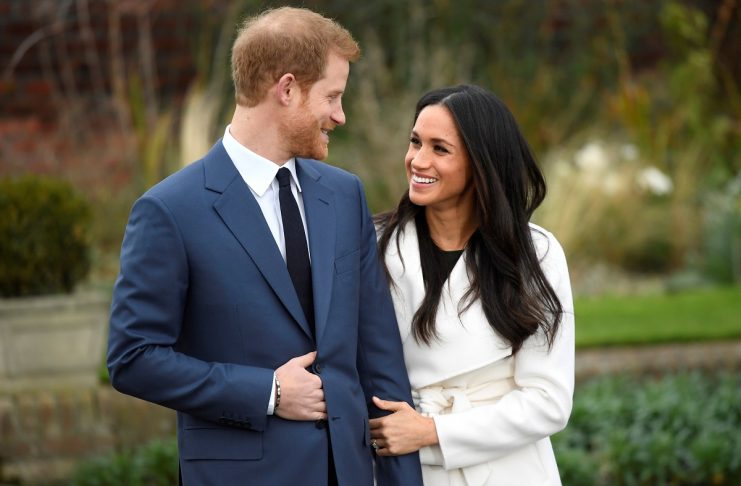 Britain’s Prince Harry poses with Meghan Markle in the Sunken Garden of Kensington Palace, London