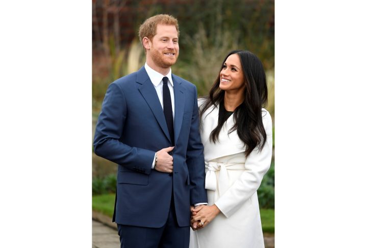 Britain’s Prince Harry poses with Meghan Markle in the Sunken Garden of Kensington Palace, London