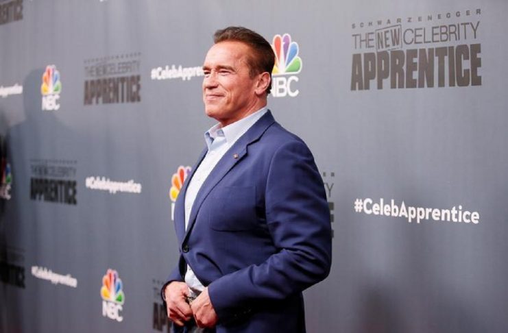 Arnold Schwarzenegger poses after a panel for “The New Celebrity Apprentice” in Universal City