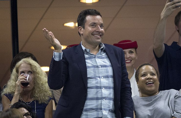 Television personality Jimmy Fallon dances as he attends the quarterfinals match between Federer of Switzerland and Gasquet of France at the U.S. Open Championships tennis tournament in New York