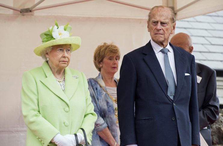 Queen Elizabeth II and Prince Philip, Duke Of Edinburgh attend the unveiling of the Robert Quigg VC memorial statue in Bushmills village