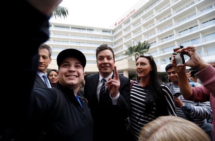 Host and comedian Fallon poses with fans after a red carpet rollout during preparations for the 73rd Annual Golden Globe Awards in Beverly Hills
