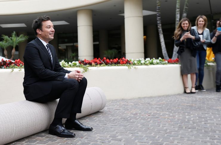 Host and comedian Fallon sits before a red carpet rollout during preparations for the 73rd Annual Golden Globe Awards in Beverly Hills