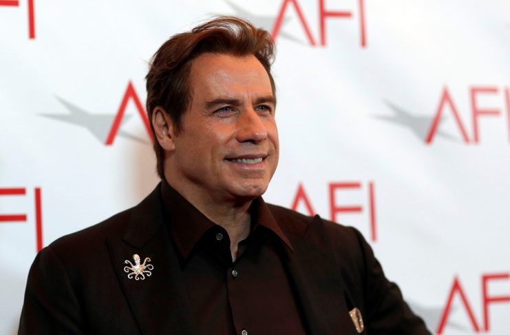 Actor Travolta poses at the American Film Institute Awards in Los Angeles