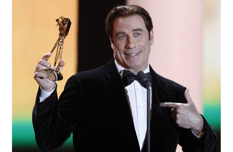 U.S.actor John Travolta receives the award for best international actor during Golden Camera awards in Berlin