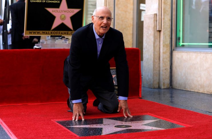 Actor Tambor poses by his star after it was unveiled on the Hollywood Walk of Fame in Los Angeles
