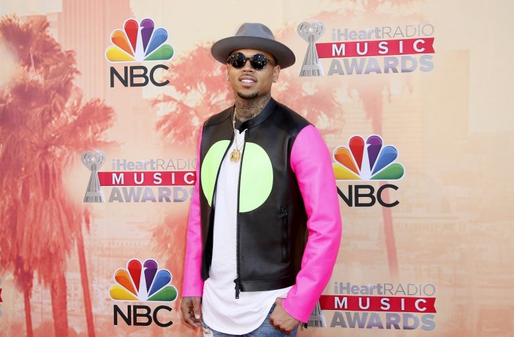 Singer Chris Brown poses at the 2015 iHeartRadio Music Awards in Los Angeles