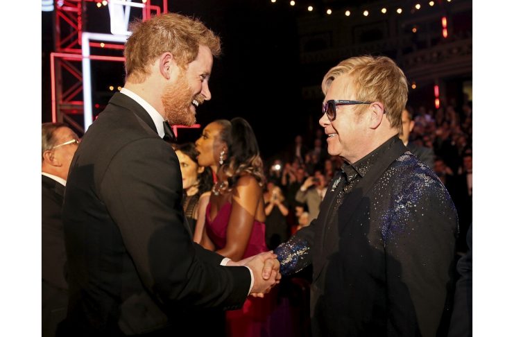 Britain’s Prince Harry greets Elton John after the Royal Variety Performance at the Albert Hall in London