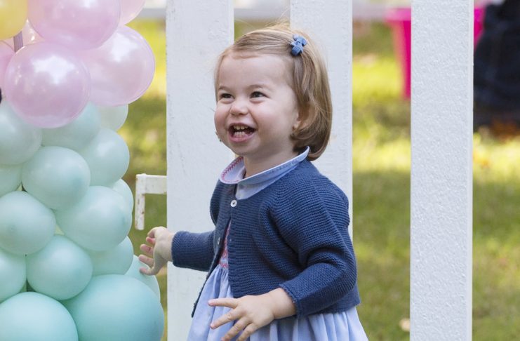 Princess Charlotte plays with balloons during a children’s party at Government House in Victoria