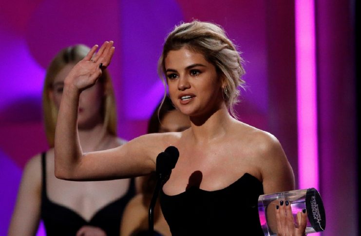 Singer Gomez accepts the Woman of the Year award at the Billboard Women in Music awards in Los Angeles