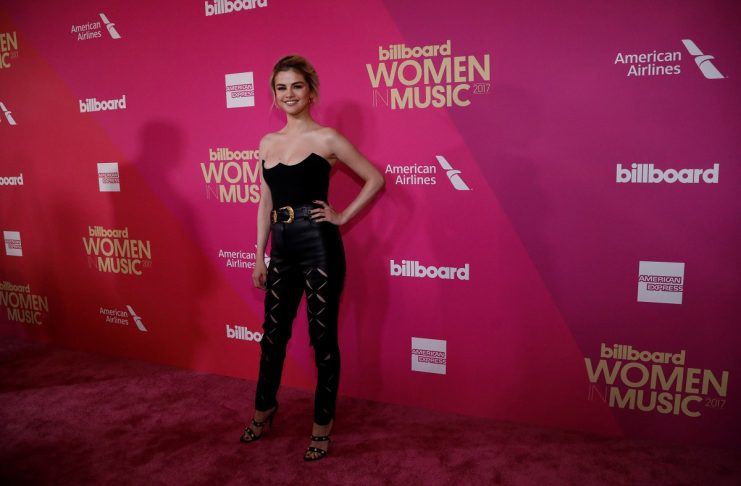 Singer Gomez poses at the Billboard Women in Music awards in Los Angeles