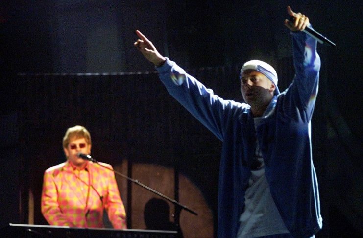Rap Singer Eminem (R) performs the song “Stan” with Elton John at the 43rd annual Grammy Awards in L..