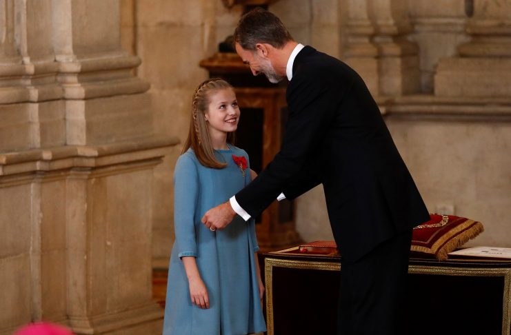 Spain’s King Felipe smiles after presenting his daughter Princess Leonor with the insignia of the “Toison de Oro” (Order of the Golden Fleece) during a ceremony at the Royal Palace in Madrid