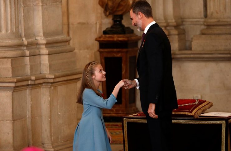 Princess Leonor does a curtsy to her father Spain’s King Felipe after he presented her with the insignia of the “Toison de Oro” (Order of the Golden Fleece) during a ceremony at the Royal Palace in Madrid