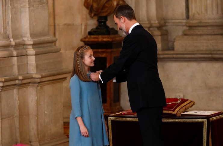 Spain’s King Felipe presents his daughter Princess Leonor with the insignia of the “Toison de Oro” (Order of the Golden Fleece) during a ceremony at the Royal Palace in Madrid