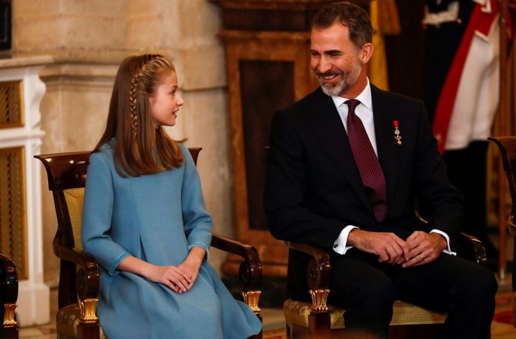 Spain’s King Felipe sits next to his daughter Princess Leonor during a ceremony where she was presented with the insignia of the “Toison de Oro” (Order of the Golden Fleece)  at the Royal Palace in Madrid
