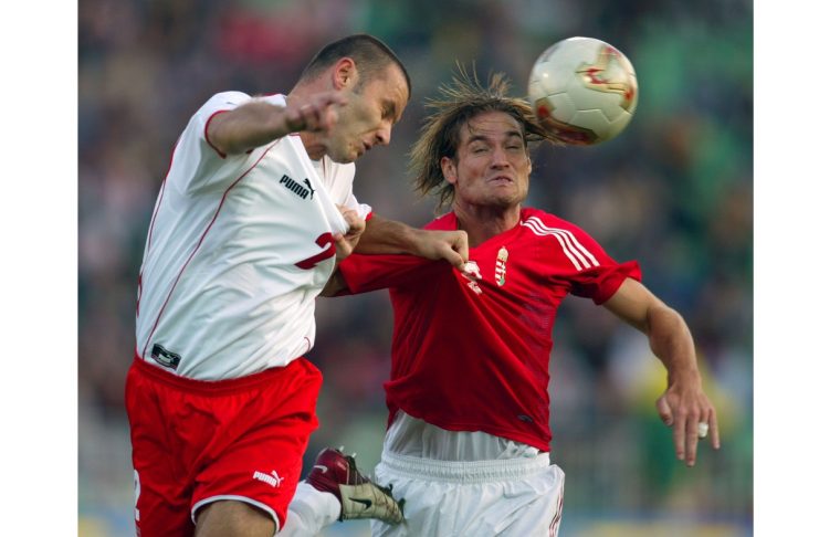 HUNGARIAN MIKLOS FEHER CHALLENGES POLAND’S TOMAS KLOS DURING EURO 2004
GROUP FOUR QUALIFYING SOCCER …