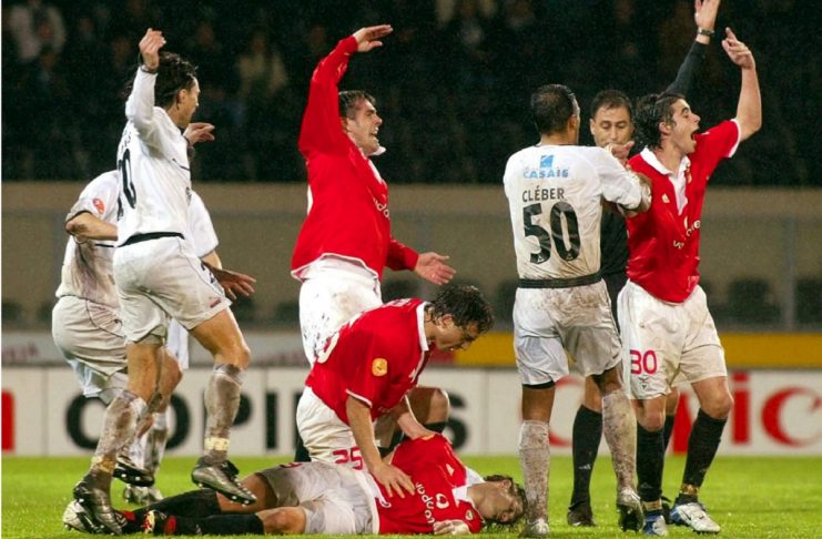 PLAYERS WAVE ASKING FOR HELP FOR BENFICA’S HUNGARIAN SOCCER STRIKER MIKLOS FEHER.
