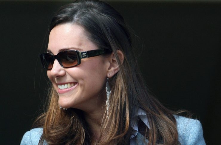 Kate Middleton, girlfriend of Britain’s Prince William, smiles while attending the final day of the Cheltenham Festival horse racing in Gloucestershire