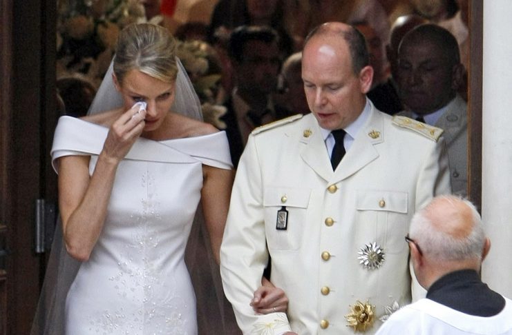 Charlene Princess of Monaco wipes tears as she leaves the Sainte Devote Church after her wedding to Prince Albert II of Monaco in Monaco