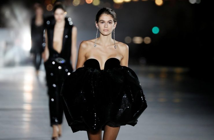 Model Kaia Gerber presents a creation by designer Anthony Vaccarello as part of his Spring/Summer 2018 women’s ready-to-wear collection show  for fashion house Saint Laurent during Paris Fashion Week