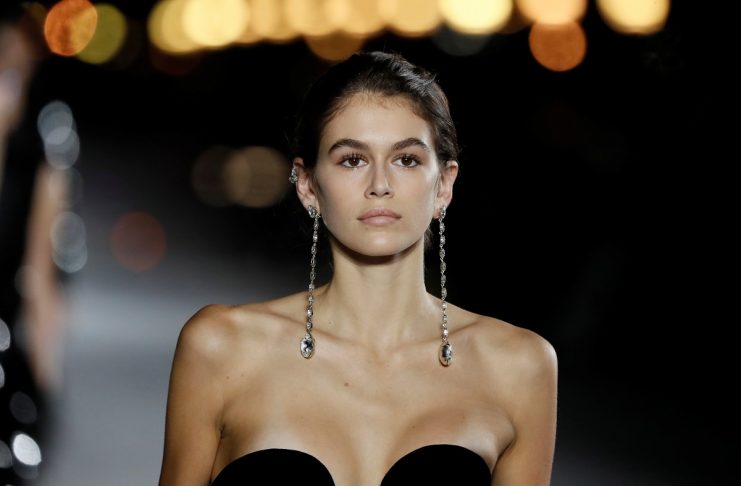 Model Kaia Gerber presents a creation by designer Anthony Vaccarello as part of his Spring/Summer 2018 women’s ready-to-wear collection show  for fashion house Saint Laurent during Paris Fashion Week