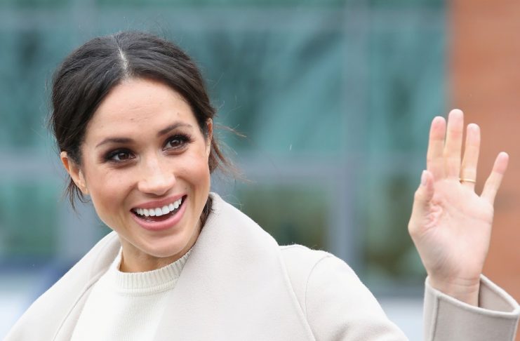 The fiancee of Britain’s Prince Harry, Meghan Markle, reacts after a visit to a science park called Catalyst Inc., in Belfast