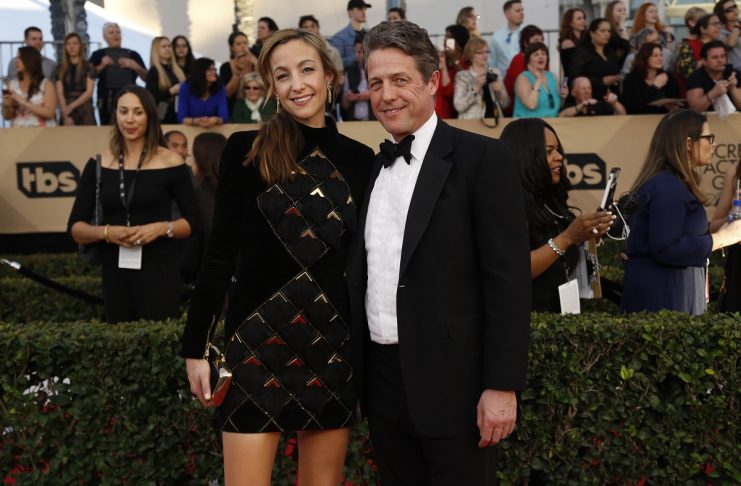 Actor Hugh Grant and Anna Elisabet Eberstein arrive at the 23rd Screen Actors Guild Awards in Los Angeles