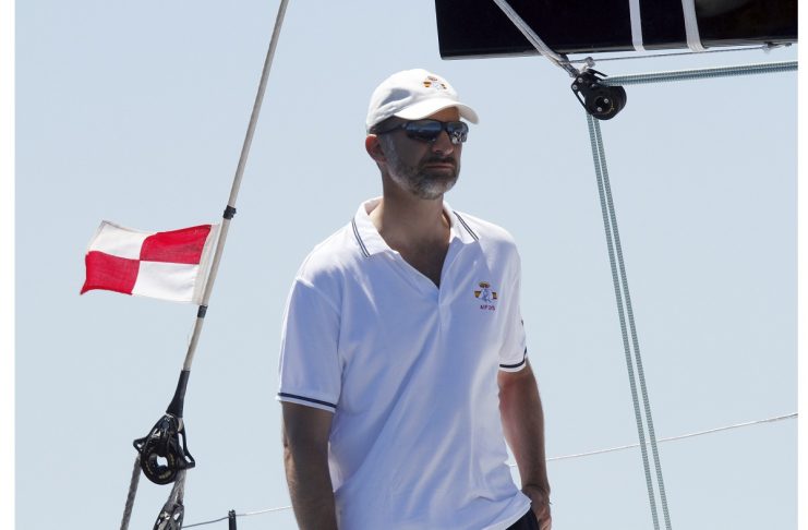 Spain’s Crown Prince Felipe stands aboard the “Aifos” yacht during the 32nd King’s Cup yachting race in Palma de Mallorca