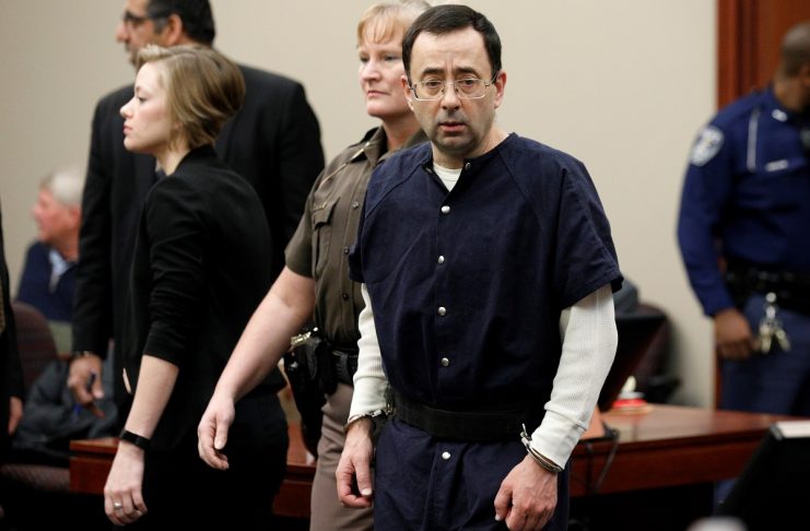 Larry Nassar, a former team USA Gymnastics doctor who pleaded guilty in November 2017 to sexual assault charges, arrives in the courtroom during his sentencing hearing in Lansing