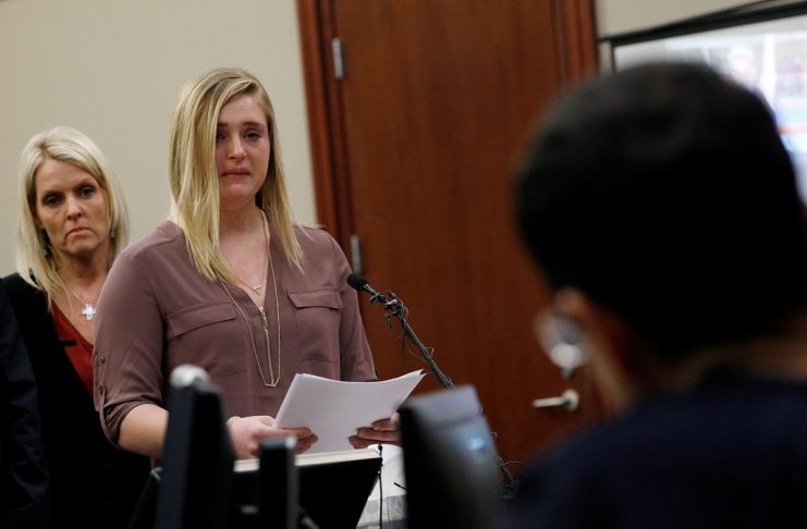 Victim and former gymnast Maddie Johnson speaks as he mother Kelly Johnson looks on at the sentencing hearing for Larry Nassar, a former team USA Gymnastics doctor who pleaded guilty in November 2017 to sexual assault charges, in Lansing