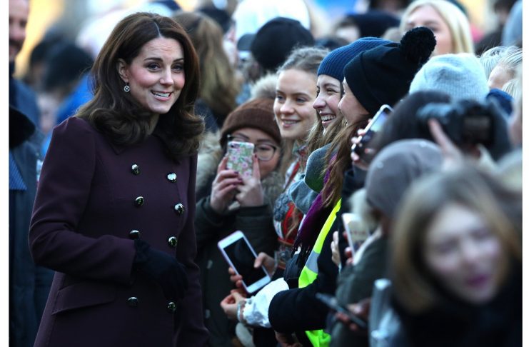 Britain’s Catherine, Duchess of Cambridge, greets members of the public as she arrives with Prince William at Hartvig Nissen School in Oslo
