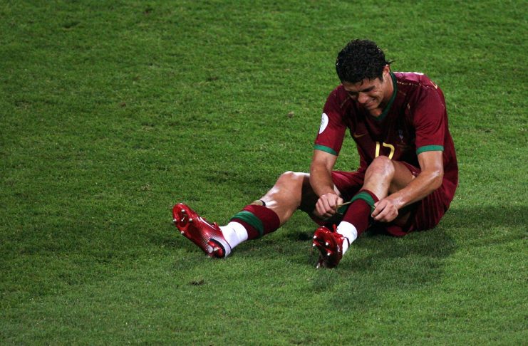 Portugal’s Cristiano Ronaldo sits injured on the pitch during their second round World Cup 2006 soccer match against the Netherlands in Nuremberg