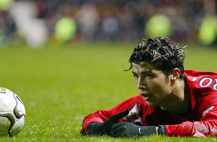 MANCHESTER UNITED’S RONALDO LOOKS UP AFTER BEING TACKLED BY EVERTON’S HIBBERT AT OLD TRAFFORD.